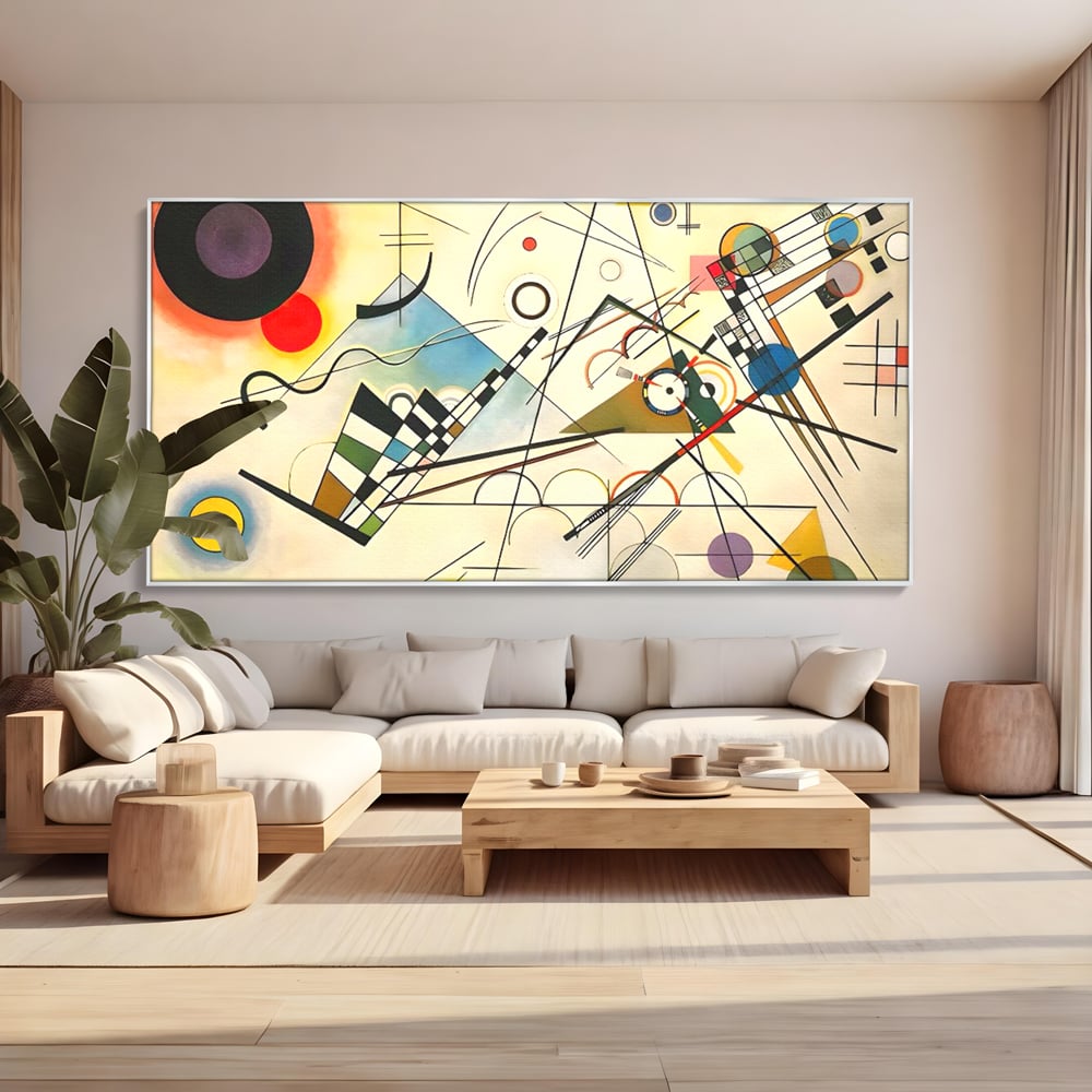 Tablou canvas cu pictura abstracta cu forme geometrice colorate, in rama de aluminiu argintiu, pe perete intr-un living